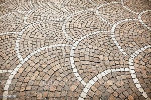 Outdoor G603 granite stone floor surface arranged in curved patterns